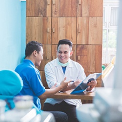 A man consulting with his dentist about implants