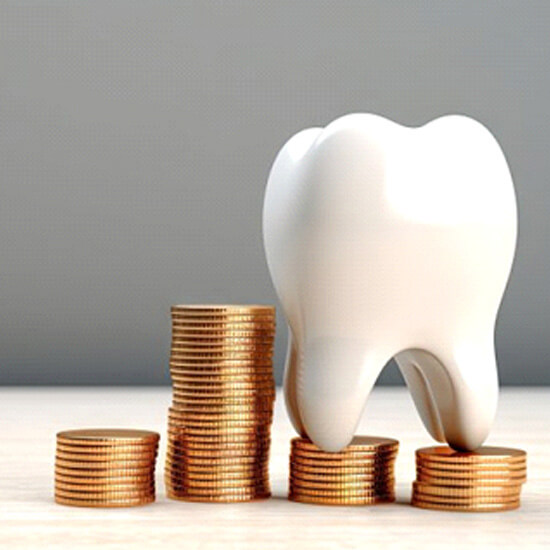 A tooth sitting atop a stack of coins