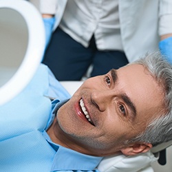 Man smiling after getting cosmetic dentistry in Grand Island