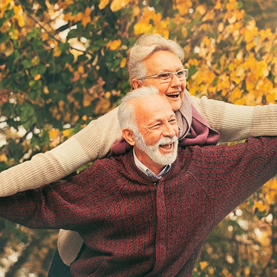 couple smiling with dentures in Grand Island