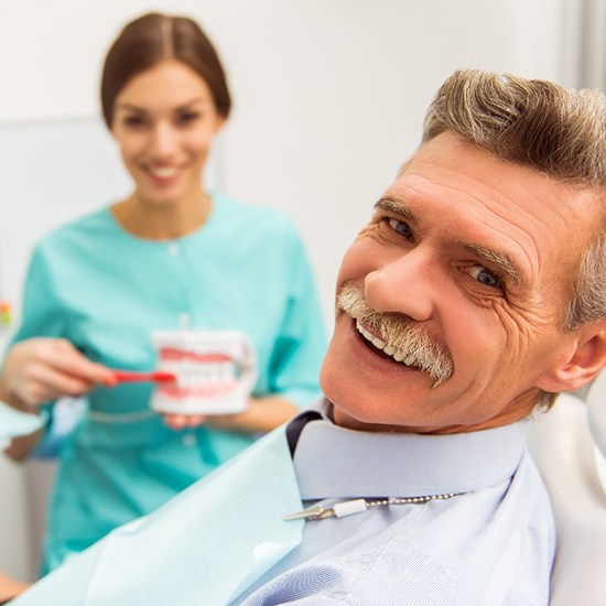 patient smiling with dentures in Grand Island