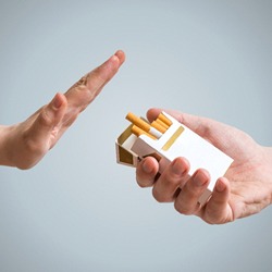 person rejecting cigarettes