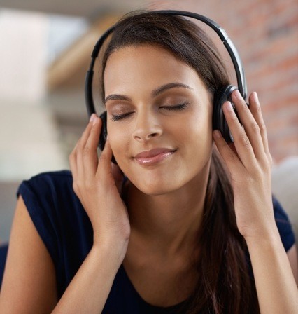 Woman listening to music with headphones