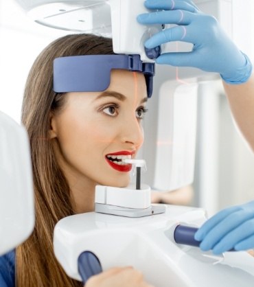 Woman getting digital scans of her mouth in dental office