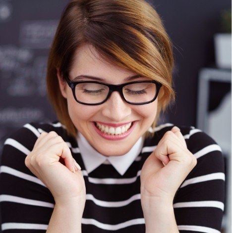 woman with glasses on smiling