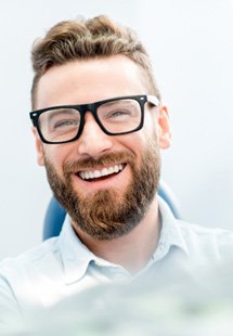 man smiling in dental chair 