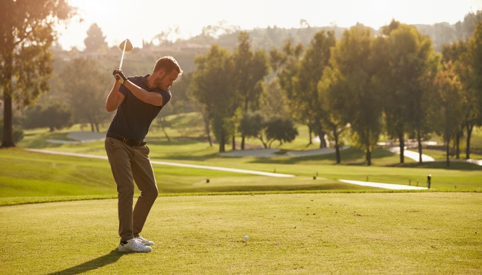 man golfing