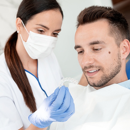 showing man invisalign tray