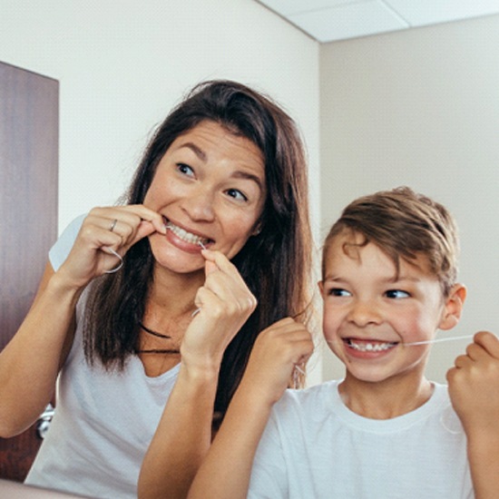 Mother and son preventing dental emergencies in Grand Island