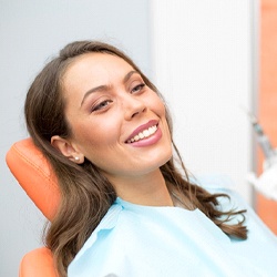Woman smiling in her emergency dental office in Grand Island