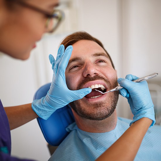 man getting dental cleaning