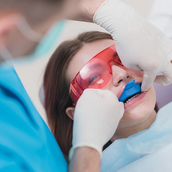 girl getting fluoride treatment