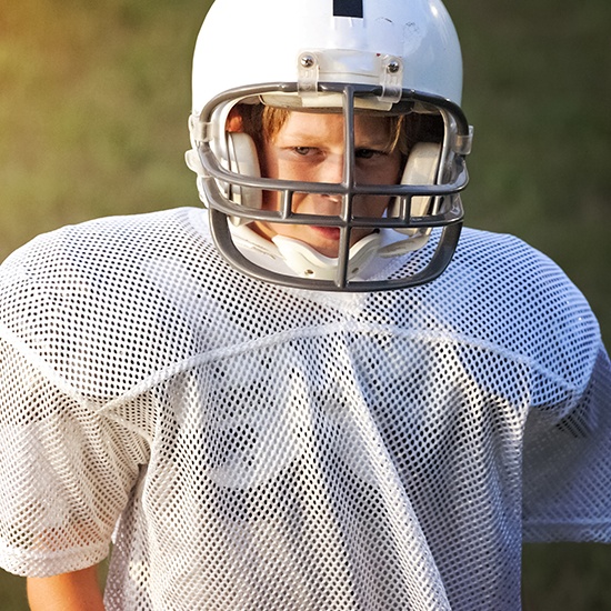 boy in football uniform