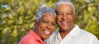 husband and wife smiling together