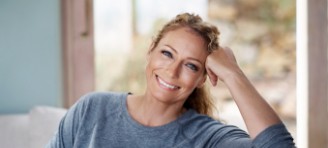 woman smiling on couch