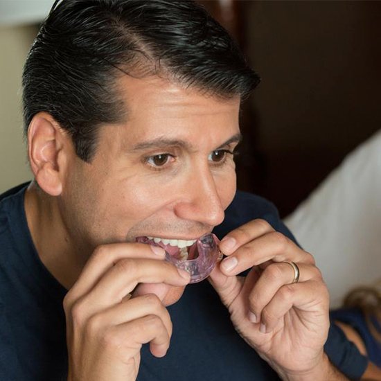 man putting in oral appliance