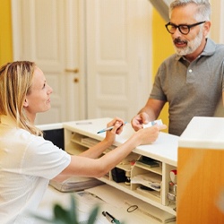 patient paying dentist in Grand Island