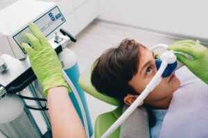 A boy undergoing nitrous oxide sedation dentistry
